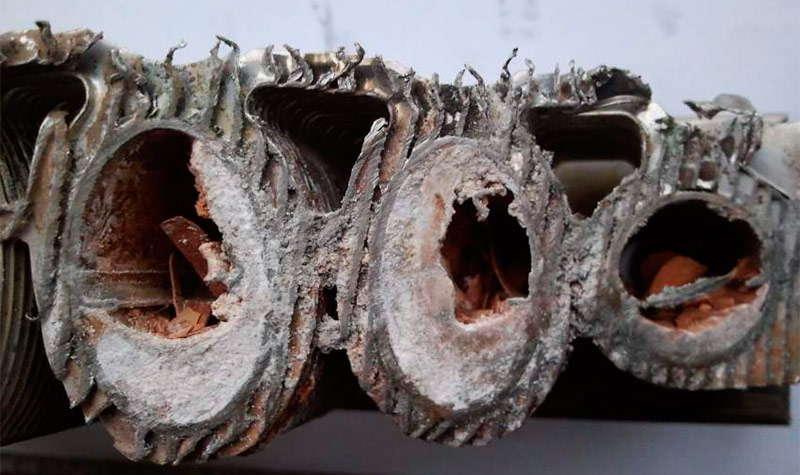Scale clogged steel heat exchanger